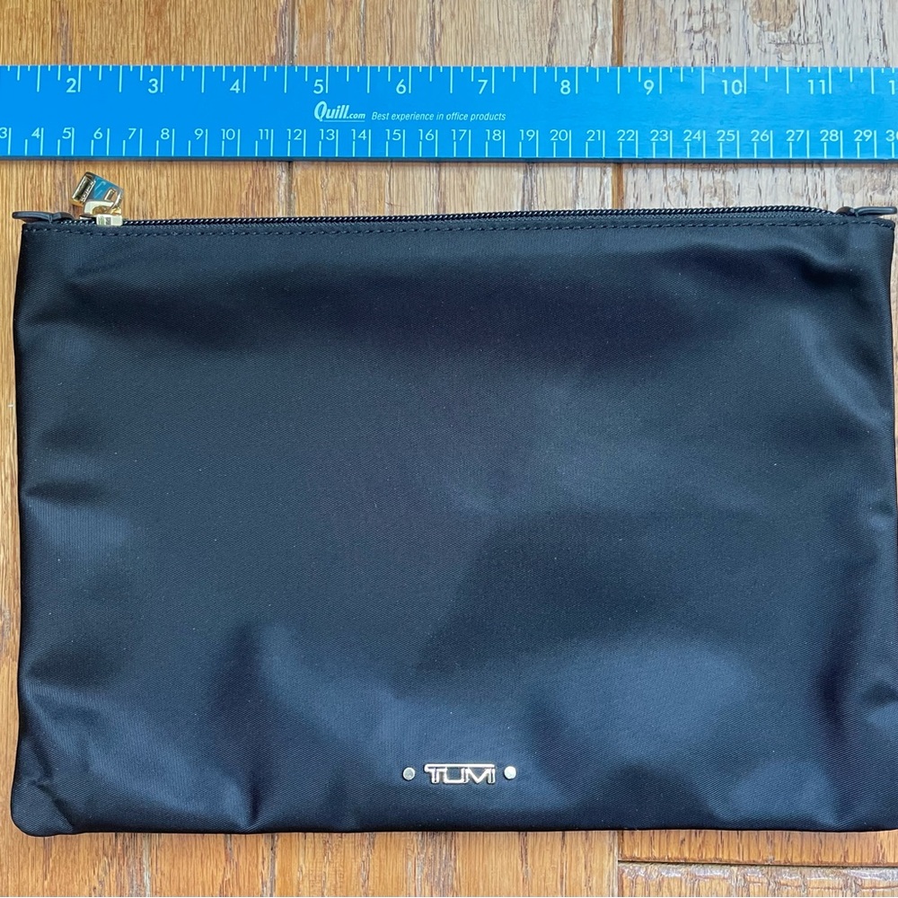 Tumi black zippered accessory case. New, never used.